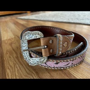 A really pretty pink belt with rhinestones on the out sides of the length